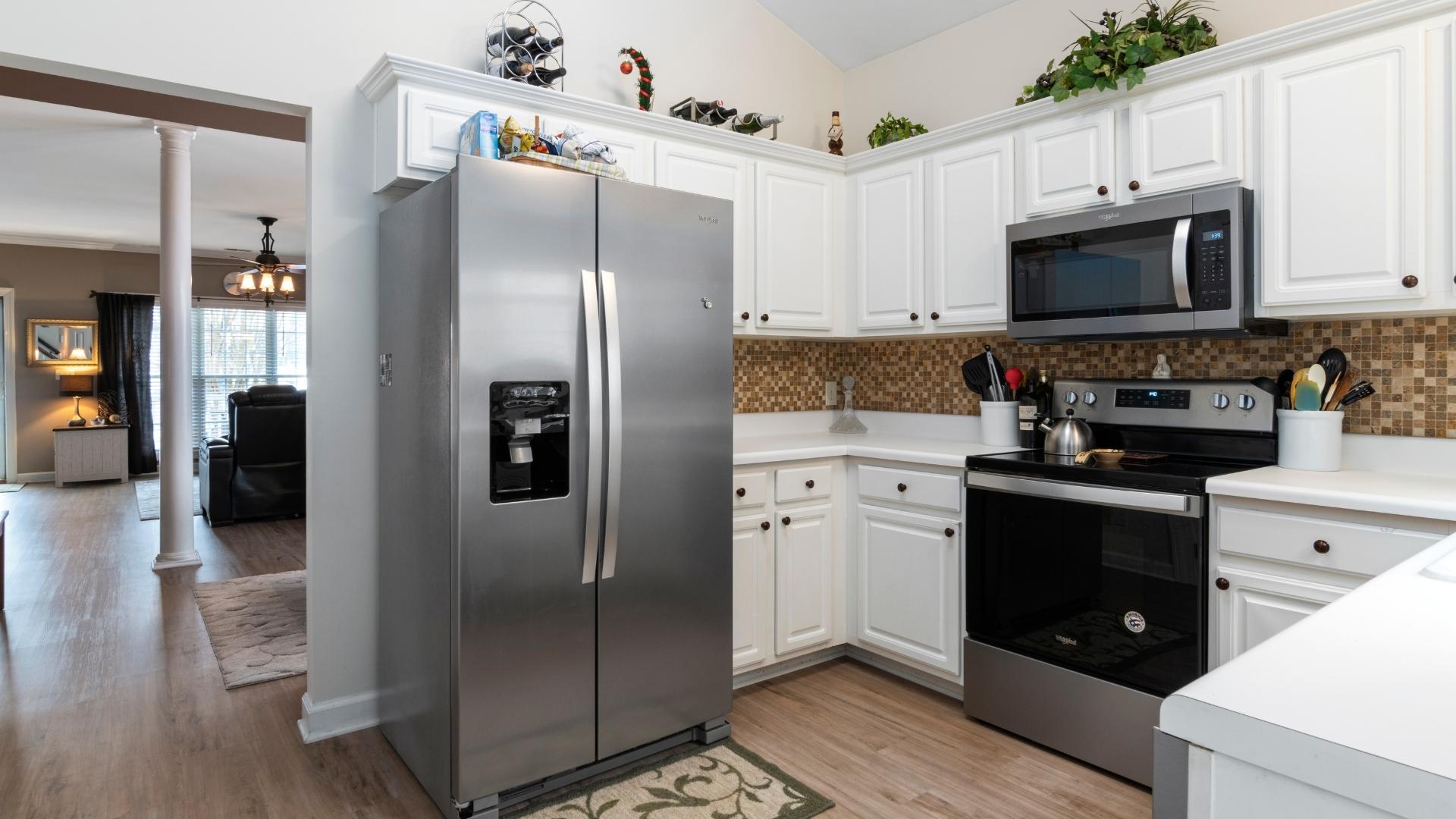 KE Cleaning Services team member cleaning a bright, tidy home interior in Jackson, MS